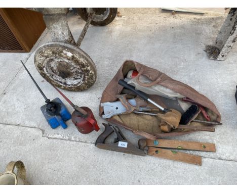 AN ASSORTMENT OF TOOLS TO INCLUDE A WOOD PLANE, AN AXE AND OIL CANS ETC 