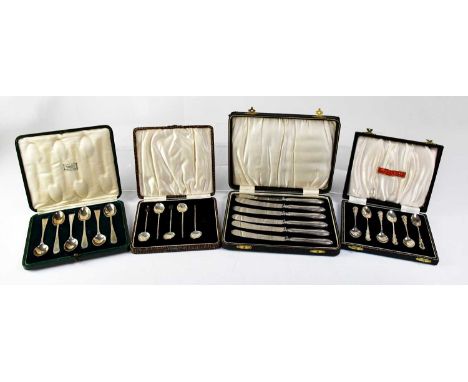 Four cased sets and partial sets of silver spoons and knives, comprising two sets of six coffee spoons, a partial set of coff