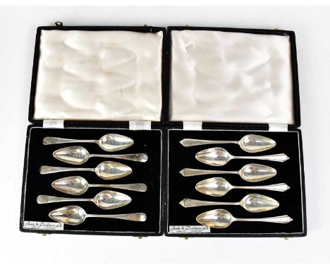 TRAVIS WILSON &amp; CO LTD, two cased sets of Elizabeth II hallmarked silver grapefruit spoons, each retailed by Boodle &amp;