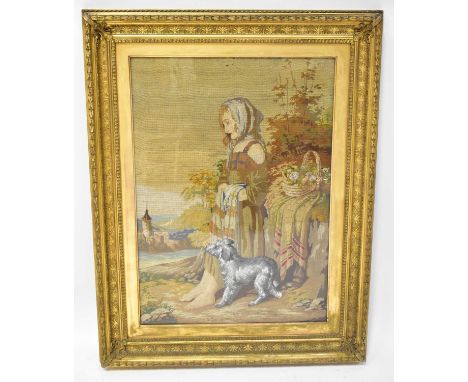 A Victorian tapestry of a girl with a dog at her feet and a basket of flowers, Hilbert Brothers label verso, 76 x 56cm, gilt 