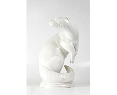 MEISSEN; a blanc de chine model of an otter posed standing on its back legs, looking over its right shoulder, by Max Esser, w