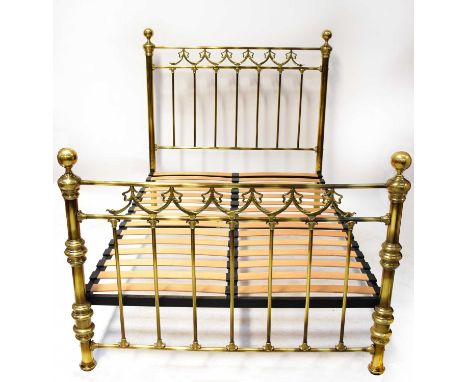 A contemporary lacquered brass double bedstead with swag and bow decoration, with slatted base suitable for standard 4'6" mat