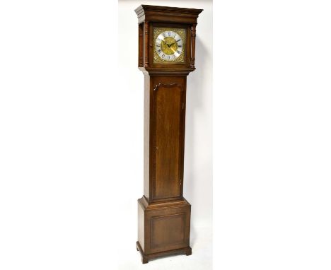 A modern oak longcase clock of small proportions, with brass face set with Roman numerals and silver chapter ring, with chimi