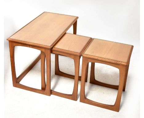 A G-Plan style vintage teak nest of three tables with glass inset tops, 50 x 76 x 40cm.