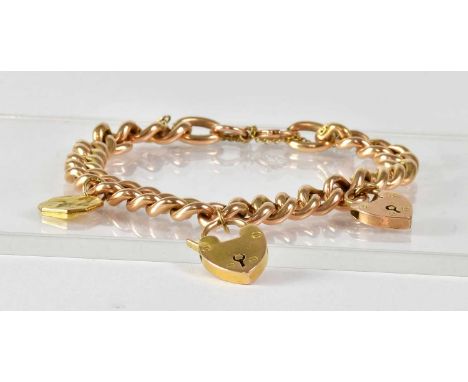 A 15ct yellow gold curb link bracelet set with a 15ct yellow gold heart-shaped padlock and a 9ct yellow gold example, and saf