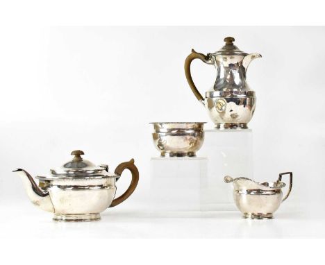 WILLIAM COMYNS &amp; SONS LTD; a George V hallmarked silver tea service comprising tea pot, coffee pot, cream jug and sugar b