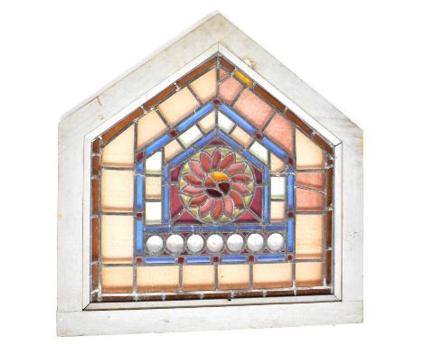 Five leaded and stained glass window panels comprising an arched panel with a central flower, in wooden frame, 60 x 61cm excl