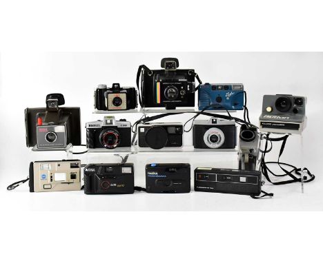 A collection of vintage cameras to include a Polaroid Super Colour Swinger Land Camera, a Polaroid Super Swinger Land camera,