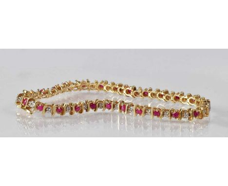 A 9ct yellow gold ruby and diamond set bracelet, length 18.5cm, approx. 9g.