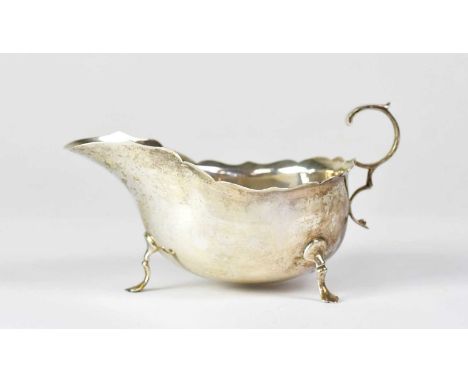 MARTIN HALL &amp; CO; an Edward VII hallmarked silver milk jug with scalloped edge, height 8cm, Sheffield 1909, approx. 3ozt.