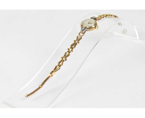 ROTARY; a 9ct yellow gold ladies' wristwatch, the white enamelled dial set with Arabic and baton numerals and inscribed 'Rota