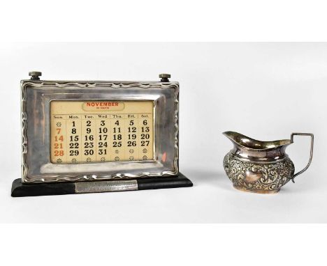 W. J. M. &amp; CO; an Elizabeth II hallmarked silver framed desk calendar, with presentation inscription 'To Inst./Lt. J. H. 