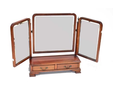 An Edwardian mahogany swing toilet mirror, the base with a pair of frieze drawers, on ogee bracket feet, 72 x 61 x 20cm.Condi