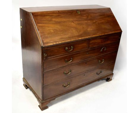 A George III mahogany fall-front bureau with fitted interior, above two small over three large drawers, with swing brass hand