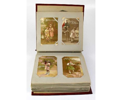 An album containing a collection of vintage postcards and silks, with French WWI examples.