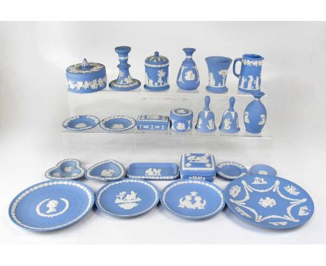 WEDGWOOD; a collection of pale blue jasperware to include trinket dishes, lidded pots, candlestick, small plates, bells, jug,