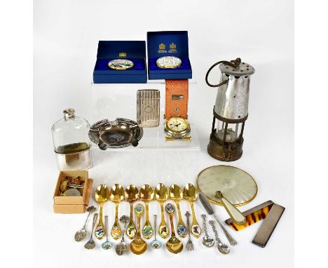A collectors' lot comprising a hallmarked silver comb and cover, a hallmarked silver card case, a silver-plated cigarette tra