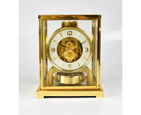 JAEGER-LECOULTRE; an Atmos mantel clock, the dial set with Arabic and baton numerals,  in original box, height 22cm.  Conditi