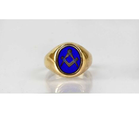 A 9ct yellow gold Masonic reversible ring, the swivelling oval cartouche set with a set square and compass with blue enamel, 