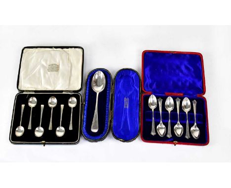 Three cased sets of silver spoons, comprising six Alfred Wolf, Liverpool coffee spoons, six teaspoons, and a dessert spoon in