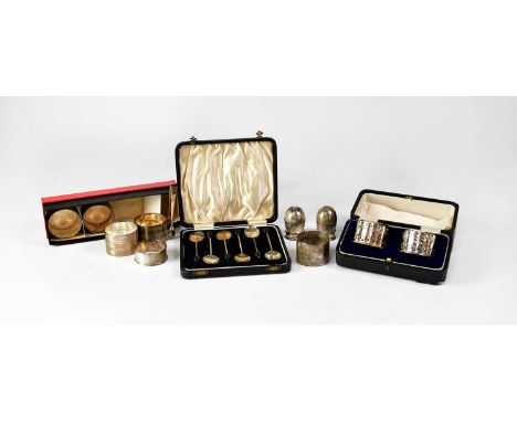 A group of hallmarked silver items, comprising a cased pair of pierced silver napkin rings, a set of four matching napkin rin