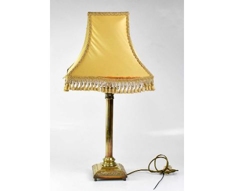 A brass table lamp in the form of a Corinthian column, on stepped square base, height 51cm.Condition Report: This lot is sold