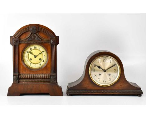 An early 20th century oak cased Napoleon hat mantel clock, the silvered dial set with Arabic numerals, movement striking on a