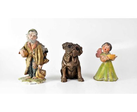A Continental porcelain figure of an elderly gentleman carrying bags, height 28cm, together with a terracotta figure of a sin