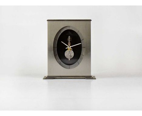 JAEGER-LECOULTRE; a boxed Pendule Baguette mantel clock in brushed chrome finish, the dial set with baton numerals, with pers