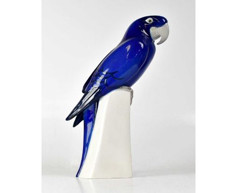 ROYAL COPENHAGEN; a model of a macaw perched on a plinth, after Armand Petersen, numbered 2235, with impressed and painted ma