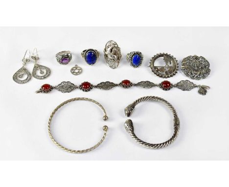 A group of silver and white metal jewellery, comprising a filigree bracelet set with carnelian cabochons, a pair of teardrop-