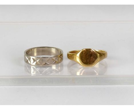 An 18ct white gold wedding band with engraved 'X' decoration, stamped 18, size L1/2, approx. 3.1g, together with a 9ct gold s