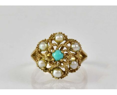 A 9ct yellow gold filigree floral cluster ring set with six seed pearls surrounding a central turquoise stone, size P, approx