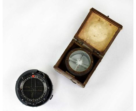 A WWII Bombsight "D", numbered 6E/ 276, No. 26415 K, diameter 10cm, in original box, together with a WWII compass Type P.8.M,