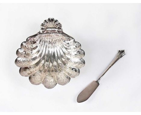 C. J. VANDER LTD; an Elizabeth II hallmarked silver shell-form butter dish with engraved decoration, raised on three scroll f
