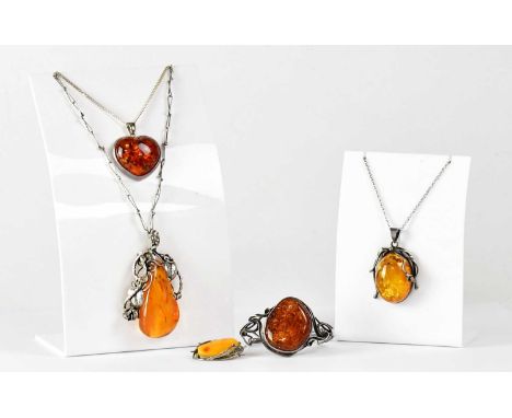 Five pieces of amber jewellery, comprising a pendant set in wrythen white metal leaf and vine mount, on chain, a butterscotch