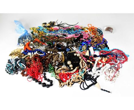 A quantity of modern and vintage costume jewellery, mainly beaded necklaces, together with some chains, bracelets, etc and a 