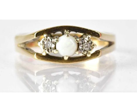 A 9ct yellow gold ring set with an opal flanked by two tiny diamonds, size N, approx. 3.2g.Condition Report: - Stamped '375' 