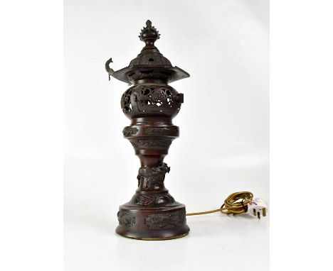 A Japanese incense burner converted to a table lamp, with pierced shade and cover, the stem with dragon, turtle and lion dog 
