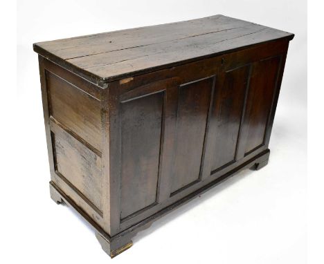A Georgian oak coffer with plank top above a fielded and panelled body, on bracket feet, 88 x 128 x 56cm.Condition Report: To
