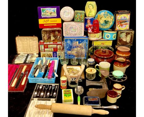 Kitchenalia - a collection of advertising tins, mid 20th century and later; wooden bread board, rolling pin, etc; milk bottle