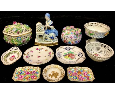 A German porcelain figure, The Bird Cage, 15cm, printed Unter Weiss Bach mark in blue; a Dresden pierced flower encrusted ova