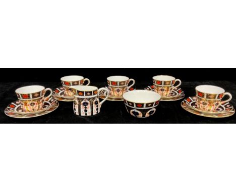 A Royal Crown Derby 1128 Imari pattern part tea service comprising sugar bowl, cream jug, five side plates, five saucers and 