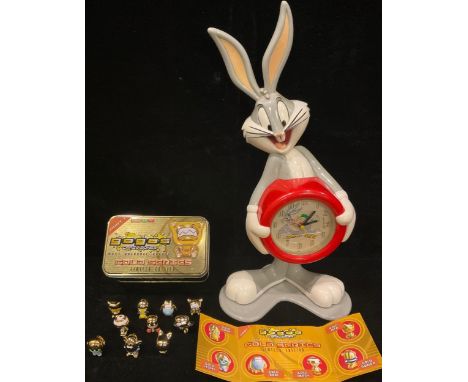 A Warner Brothers Bugs Bunny Looney Tunes clock, 43cm; a set of Gogos Crazy Bones limited edition Gold Series, in original ti