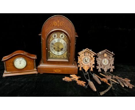 A mahogany arched top bracket clock, Junghans movement, arched brass dial, silvered chapter ring, Arabic numerals, three wind