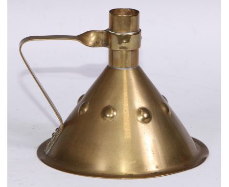 Liberty &amp; Co - an Arts and Crafts brass chamber stick, the conical base embossed with a band of faux cabochons, angular h