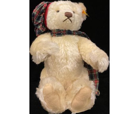 A contemporary Steiff jointed mohair bear, Winter Bear, wearing tartan, 31cm high, button to ear 