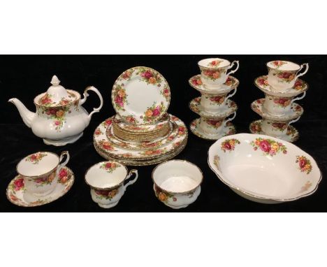 A Royal Albert Old Country Roses pattern part dinner and tea service, comprising teapot, sugar bowl, eight cups, seven saucer