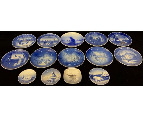 A set of ten Royal Copenhagen Christmas plates, c.1970/80; four smaller Royal Copenhagen trinket dishes (14) 