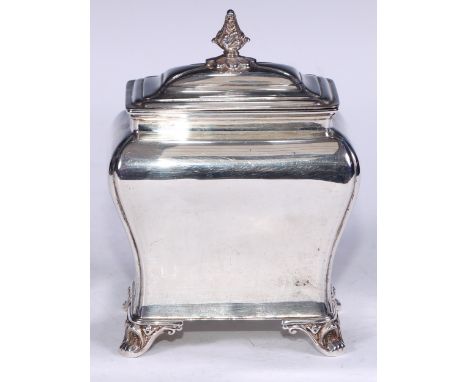 An Edwardian silver bombe shaped tea caddy, of George II design, hinged cover with acanthus bud finial, scroll feet, 14cm hig